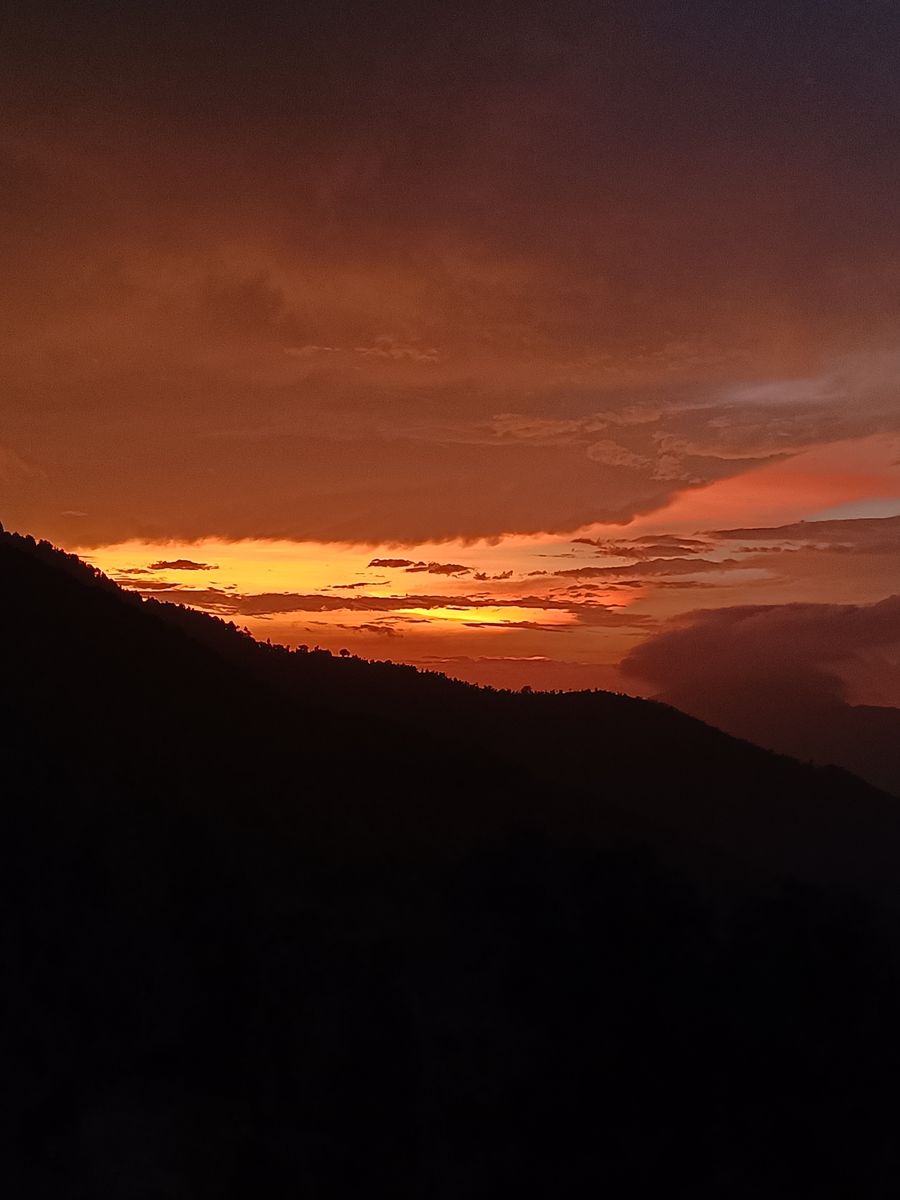 Deep crimson evening sky over the valley