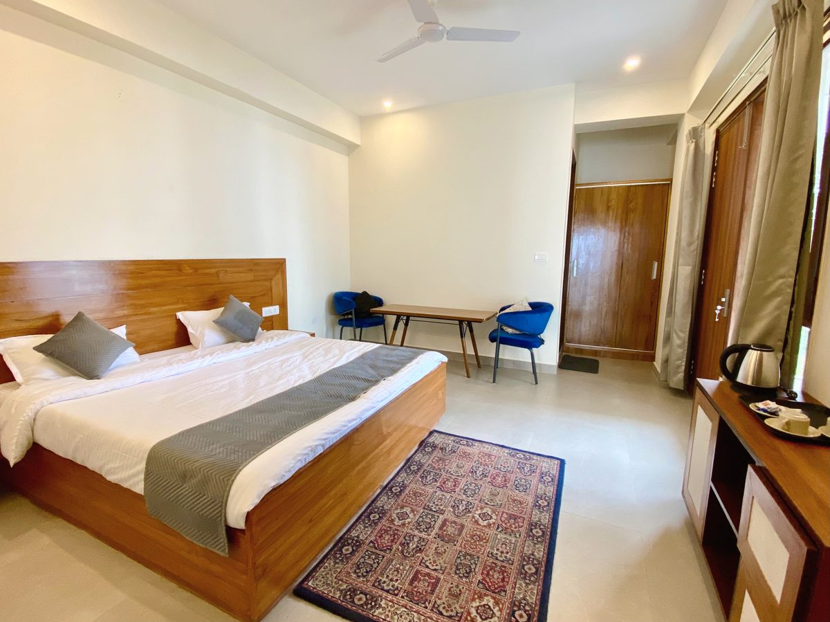 Standard room with king bed and wardrobe
